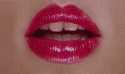 A Close Up Of A Woman 'S Lips With Red Lipstick On . GIF