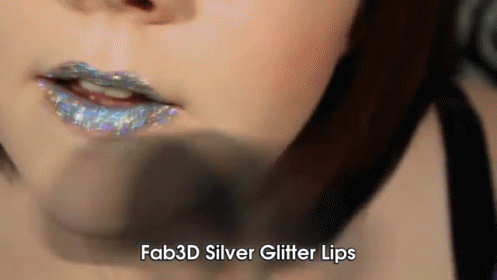 A Close Up Of A Woman 'S Lips With The Words Fab3d Silver Glitter Lips Below It GIF