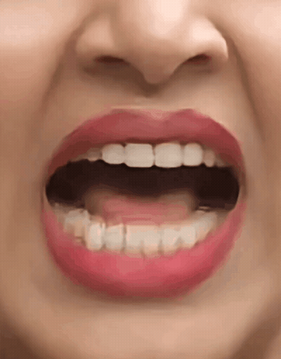 A Close Up Of A Woman 'S Mouth With Her Mouth Open And Red Lips . GIF