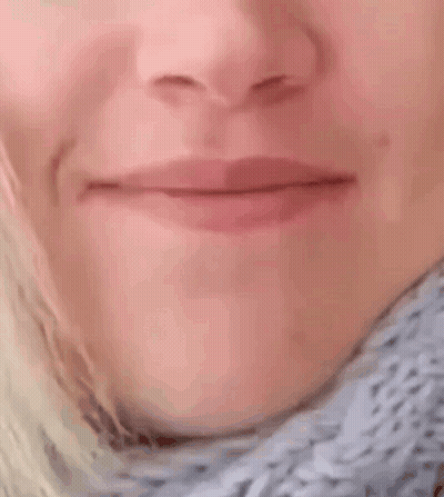 A Close Up Of A Woman 'S Mouth With Her Mouth Wide Open GIF