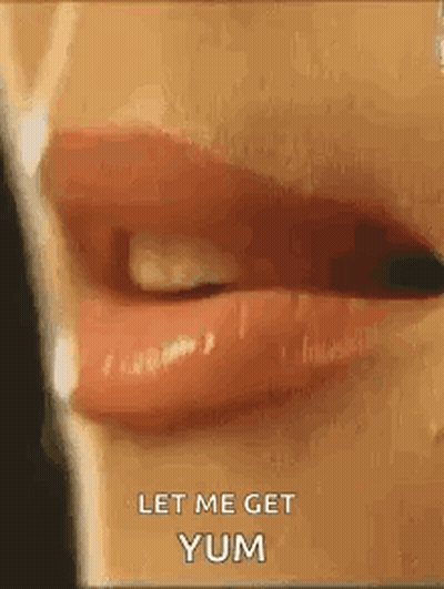 A Close Up Of A Woman 'S Mouth With Red Lipstick And The Words `` Let Me Get Yum '' . GIF