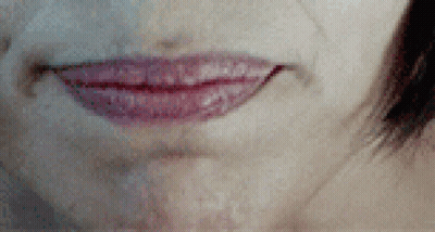 A Close Up Of A Woman 'S Mouth With Red Lipstick On GIF