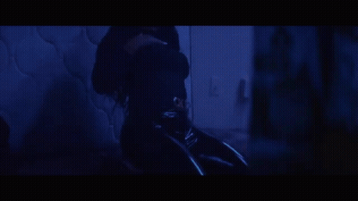 A Close Up Of A Woman 'S Mouth With Two Razor Blades In It GIF