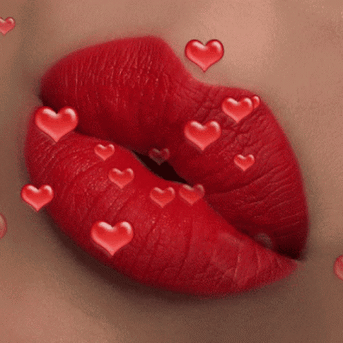 A Close Up Of A Woman 'S Red Lips With Red Hearts Coming Out Of Them GIF