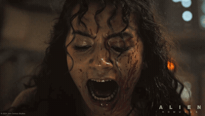 A Close Up Of A Woman Screaming With The Words Alien Romulus On The Bottom Right GIF