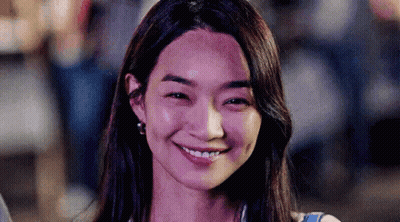 A Close Up Of A Woman Smiling With Her Eyes Closed . GIF
