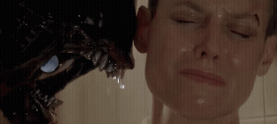 A Close Up Of A Woman Taking A Shower With Ear Plugs In Her Ear GIF