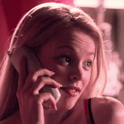 A Close Up Of A Woman Talking On A Cell Phone . GIF