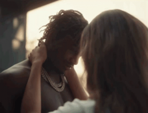A Close Up Of A Woman Touching A Man 'S Forehead GIF