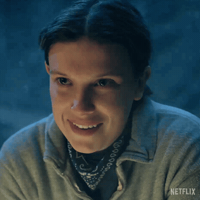 A Close Up Of A Woman Wearing A Bandana And A Netflix Logo On Her Shirt GIF