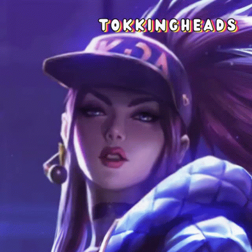 A Close Up Of A Woman Wearing A Baseball Cap With The Words Tokingheads On It GIF