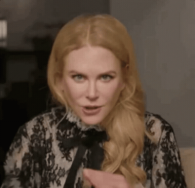A Close Up Of A Woman Wearing A Black And White Lace Dress . GIF