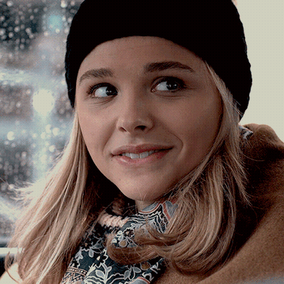 A Close Up Of A Woman Wearing A Black Hat GIF