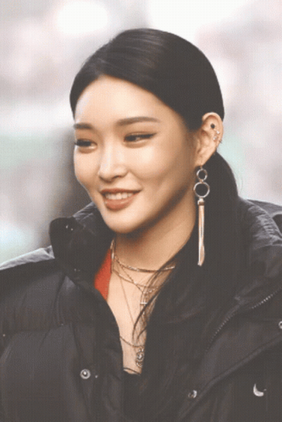 A Close Up Of A Woman Wearing A Black Jacket GIF