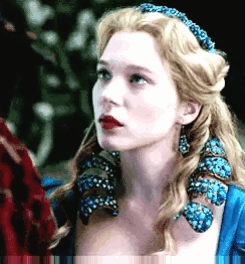 A Close Up Of A Woman Wearing A Blue Dress GIF