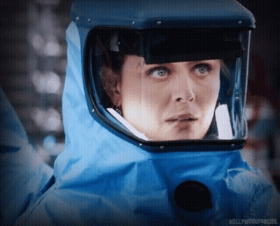 A Close Up Of A Woman Wearing A Blue Helmet With The Words Hollywoodfangirl On The Bottom GIF