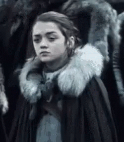 A Close Up Of A Woman Wearing A Fur Coat . GIF
