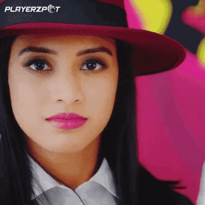 A Close Up Of A Woman Wearing A Hat With Playerzpct On It GIF