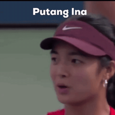 A Close Up Of A Woman Wearing A Hat With The Word Puting Ina On It . GIF