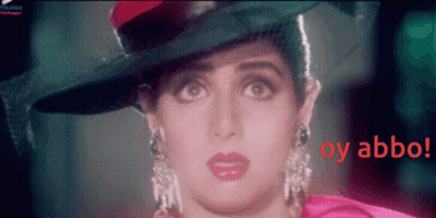 A Close Up Of A Woman Wearing A Hat With The Words Oy Abbo In Red GIF