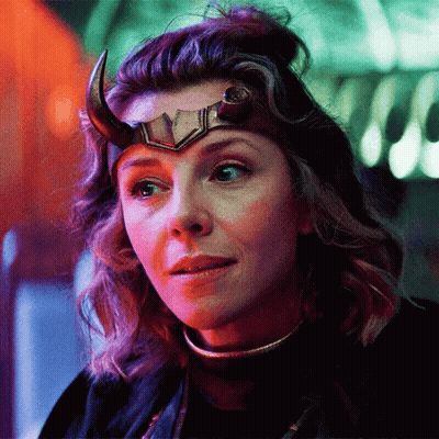 A Close Up Of A Woman Wearing A Horned Helmet . GIF