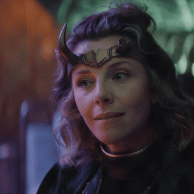 A Close Up Of A Woman Wearing A Horned Helmet GIF