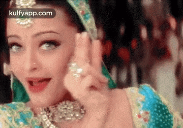 A Close Up Of A Woman Wearing A Traditional Indian Dress . GIF
