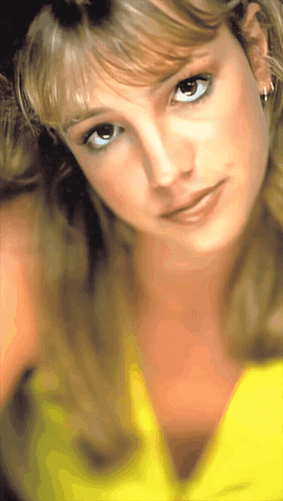 A Close Up Of A Woman Wearing A Yellow Shirt GIF
