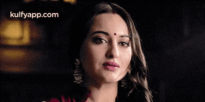 A Close Up Of A Woman With A Bindi On Her Forehead . GIF