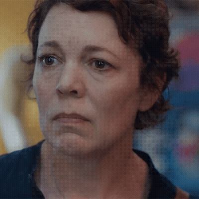 A Close Up Of A Woman With A Sad Look On Her Face GIF