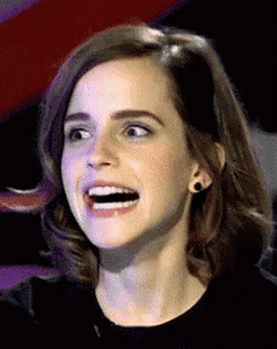 A Close Up Of A Woman With A Surprised Look On Her Face GIF