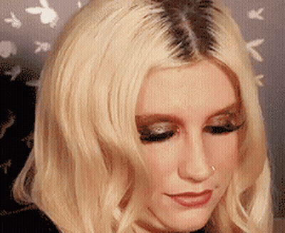 A Close Up Of A Woman With Blonde Hair GIF