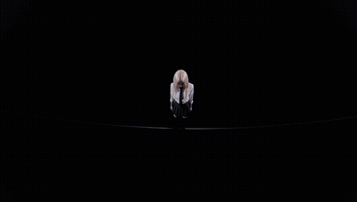 A Close Up Of A Woman With Blonde Hair Looking Down GIF