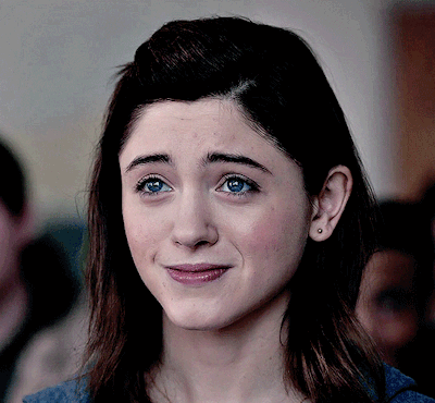 A Close Up Of A Woman With Blue Eyes GIF