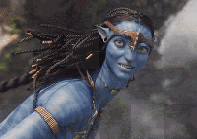 A Close Up Of A Woman With Blue Paint On Her Face And Braids . GIF