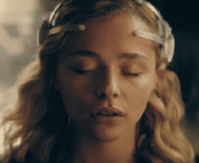 A Close Up Of A Woman With Her Eyes Closed And A Headband On Her Head GIF