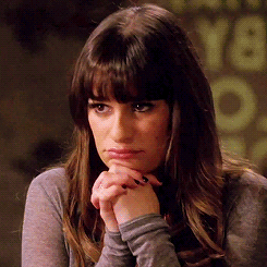 A Close Up Of A Woman With Her Hands On Her Face GIF