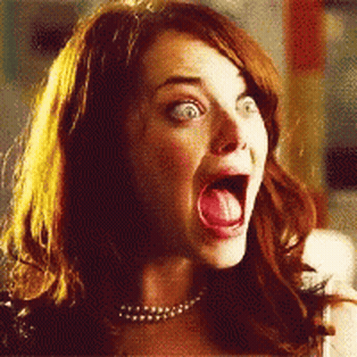 A Close Up Of A Woman With Her Mouth Open And Her Tongue Out GIF