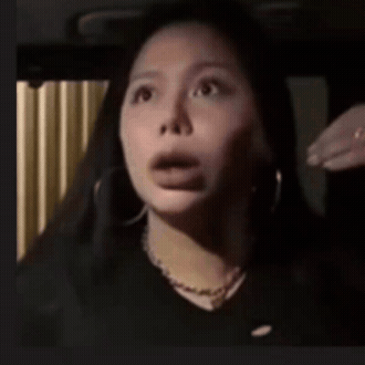 A Close Up Of A Woman With Her Mouth Open GIF