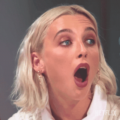 A Close Up Of A Woman With Her Mouth Open . GIF
