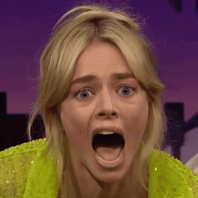A Close Up Of A Woman With Her Mouth Wide Open GIF