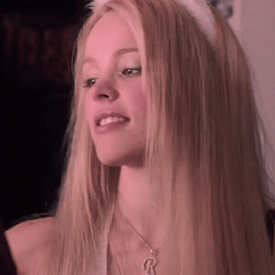 A Close Up Of A Woman With Long Blonde Hair Wearing A Cat Ear Headband And A Necklace . GIF