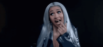 A Close Up Of A Woman With Long Blue Hair Smiling . GIF
