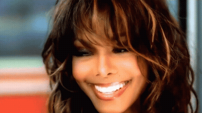 A Close Up Of A Woman With Long Hair Smiling GIF