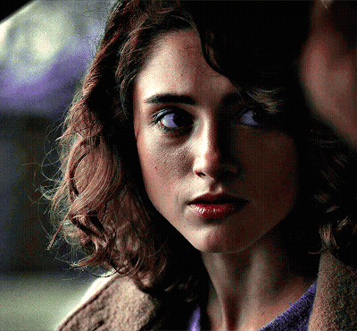 A Close Up Of A Woman With Purple Eyes GIF