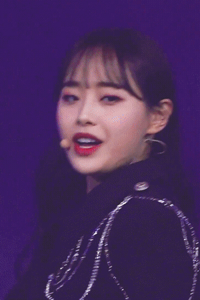 A Close Up Of A Woman With Red Lipstick On Her Lips GIF