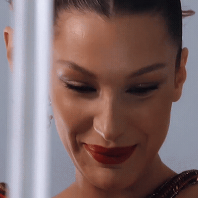 A Close Up Of A Woman With Red Lipstick On Her Lips GIF