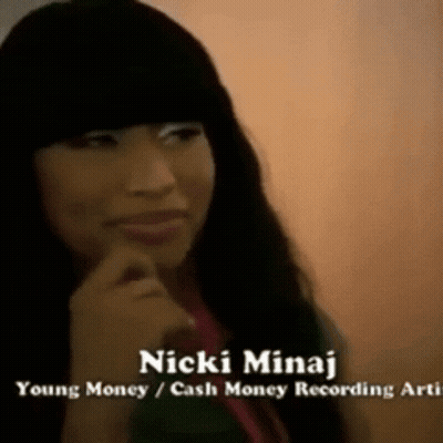 A Close Up Of A Woman With The Name Nicki Minaj On The Bottom GIF