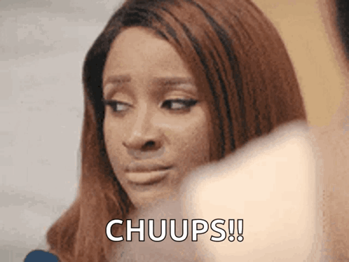 A Close Up Of A Woman With The Words Chuups Written On Her Face GIF