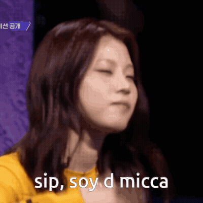 A Close Up Of A Woman With The Words Sip Soy D Micca Above Her GIF